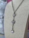 Silver Verona Lariat Necklace with cubic zircon crystal, North Star, Evil Eye, and spiked heart charms on adjustable chain